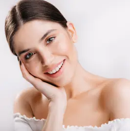 A woman receiving a facial treatment at the best skin care center, her skin flawless and glowing.