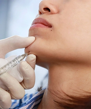 Jawline and chin Botox treatment to relax tight muscles, enhance lower-face contour, and improve balance