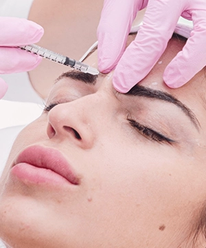 Glabella Botox treatment reduces frown lines between eyebrows and softens tension from stress