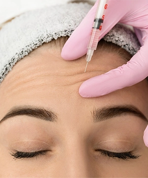 Botox treatment for forehead lines to relax muscles, smooth wrinkles, and prevent new creases