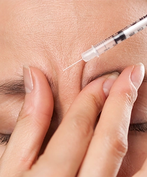 Glabella Botox treatment reduces frown lines between eyebrows and softens tension from stress